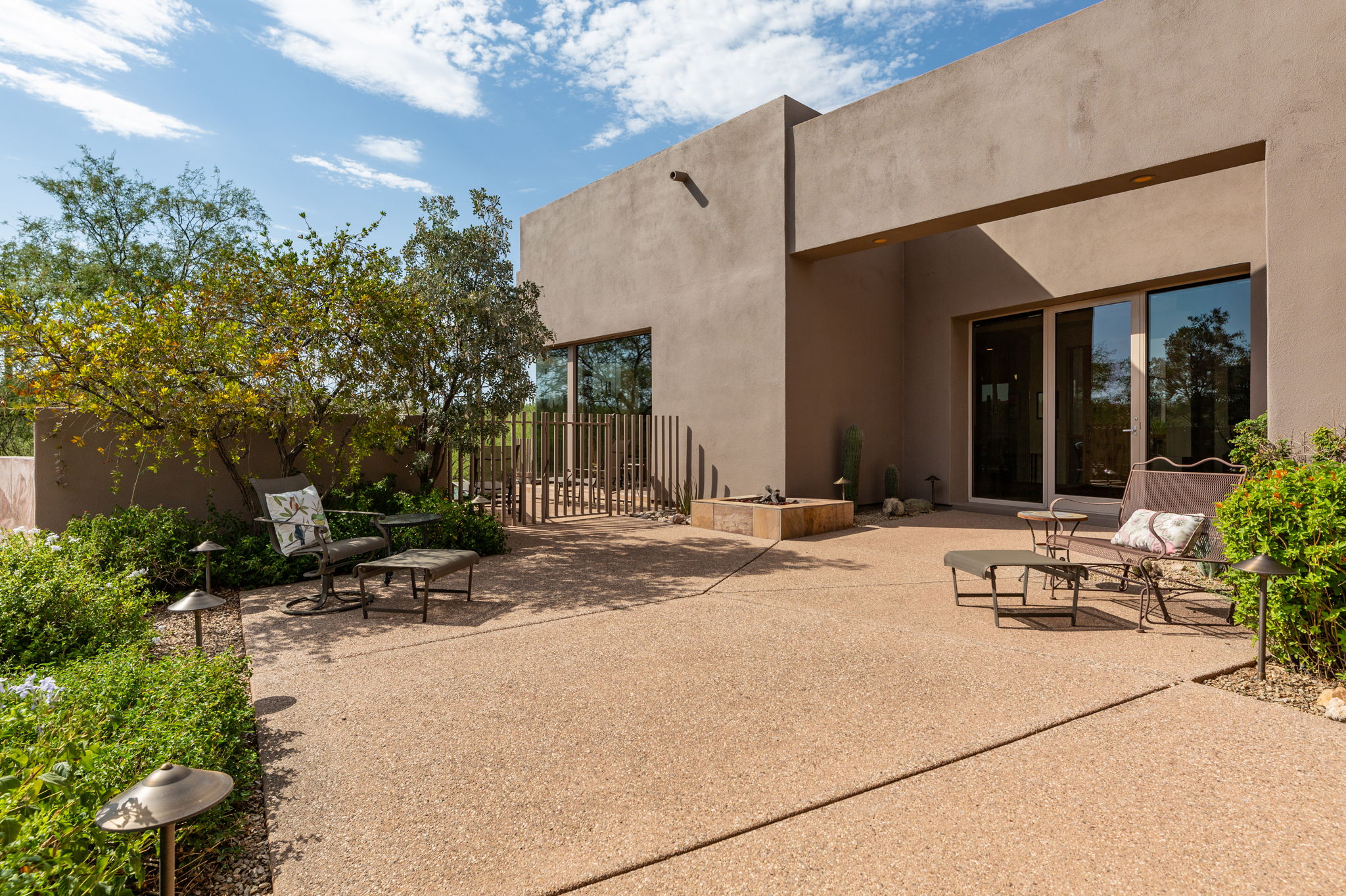 Rear Courtyard provides access to the enclosed pool area, which offers patio space for sunbathing while enjoying the serene setting and sensational views.