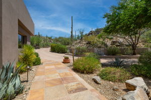 Experience a tranquil environment with three cascading waterfall features, majestic saguaros, and stunning mountain views.