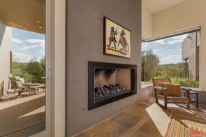 Family Room provides access to the rear covered patio space, offering stunning westward views of the desert and mountains.