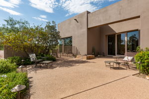 Rear Courtyard provides access to the enclosed pool area, which offers patio space for sunbathing while enjoying the serene setting and sensational views.