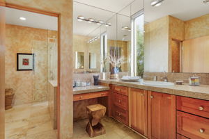 Bedroom 3 - Single sink vanity with makeup table (shared shower).