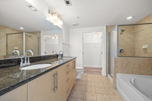 The right bedroom's bathroom has a double vanity, large closet, walk-in closet and large tub