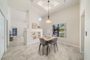 Dining Room with ceiling accent with skylights