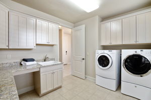 WOW! Who wouldn’t all this space in a laundry room? Washer and Dryer included