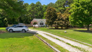 Long driveway and generous front lawn