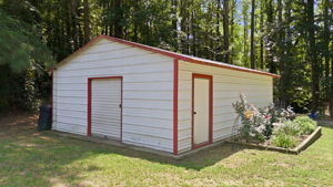 Powered storage shed with roll-up door