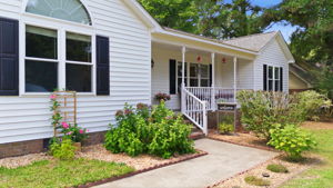 Inviting entry and colorful landscaping