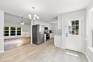 Open dining and kitchen with LVP floors
