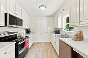 Bright galley kitchen with ample storage
