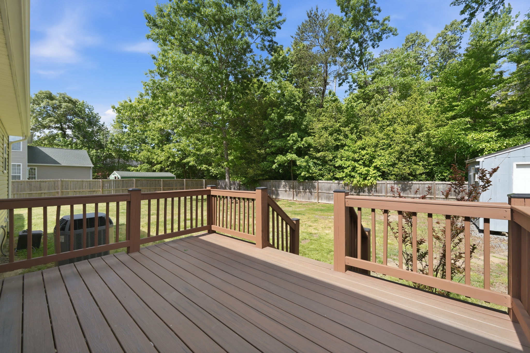 Trex deck with newly stained posts and rails