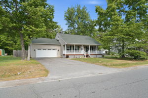 Front of House with large driveway