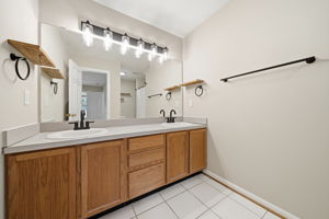 Primary bathroom with dual vanity and walk in shower