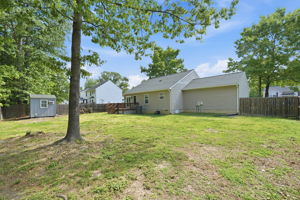 Fully fenced back yard with privacy fence