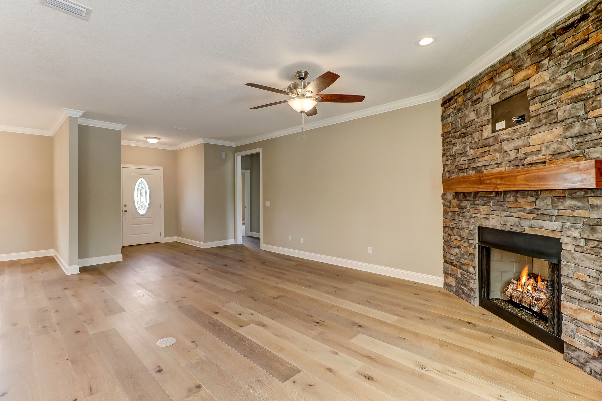 Neutral paint, 9 ft ceilings, and crown moulding add a special touch to the open concept living.