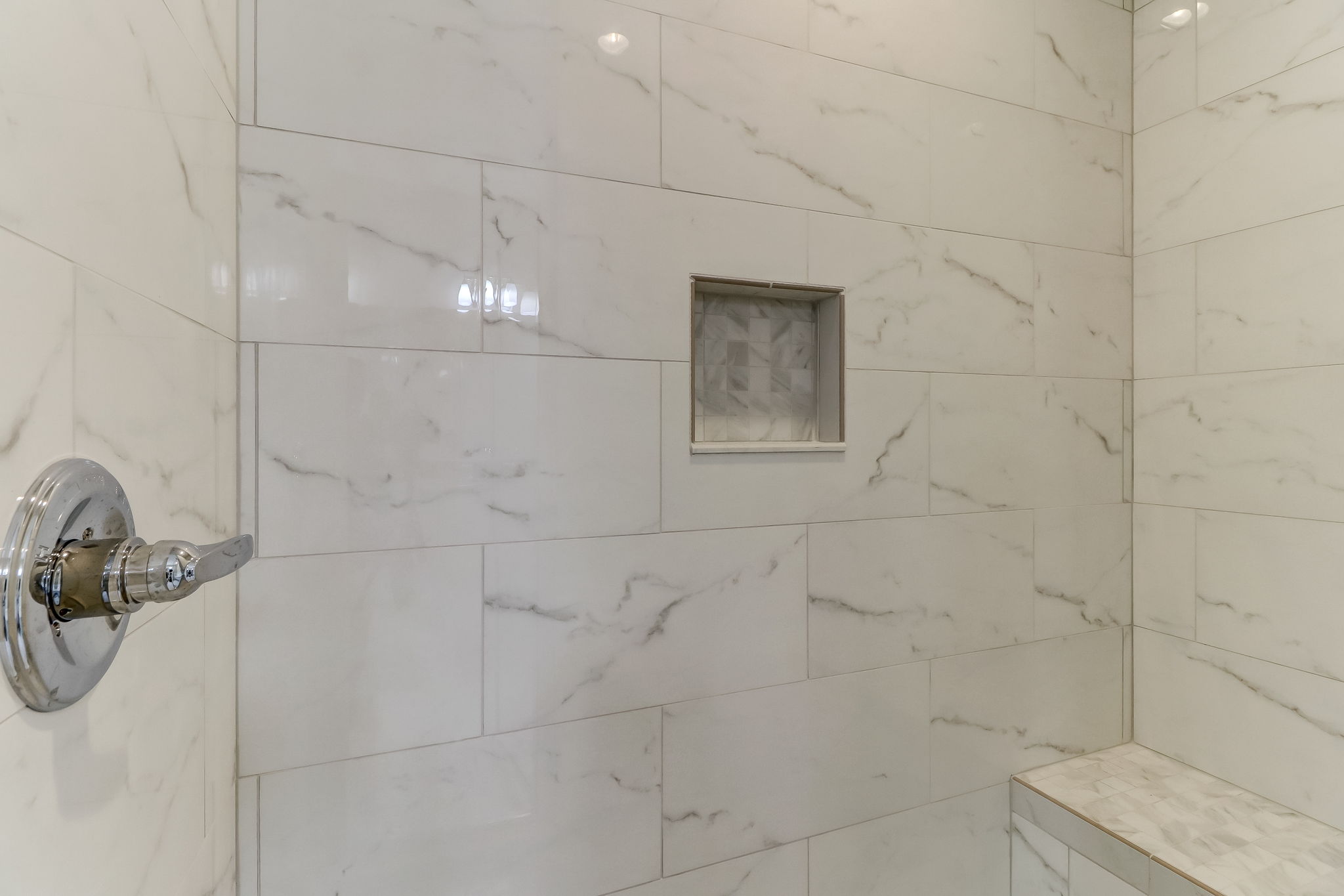 The owners suite offers privacy, comfort and plenty of natural light - don't miss the gorgeous claw foot bathtub and marble style tile in shower!