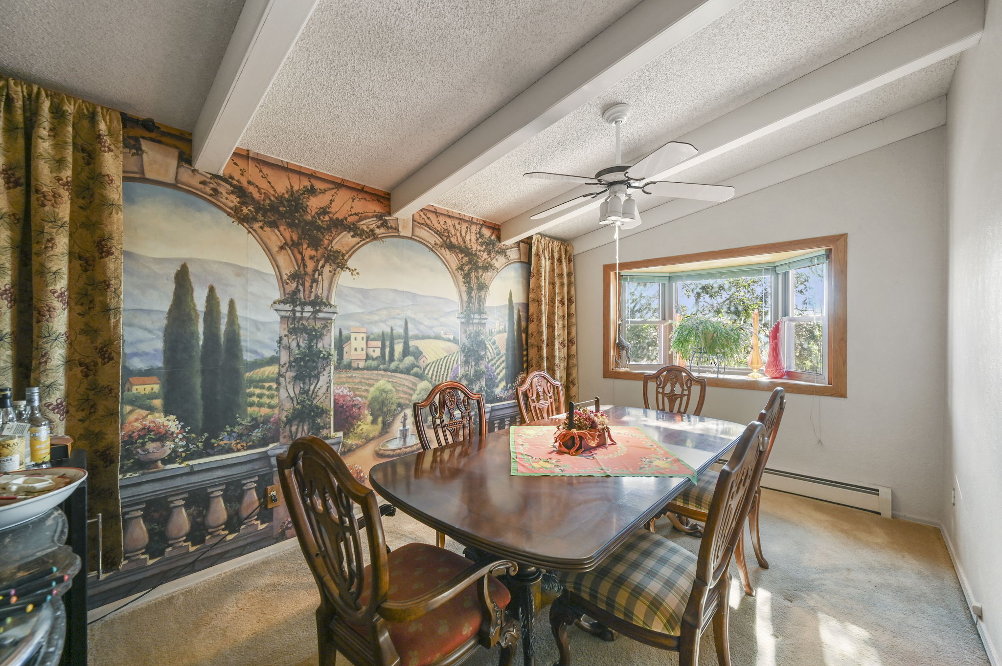 Formal dining room with bay window