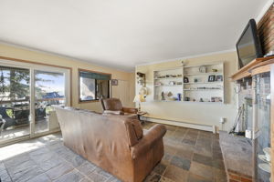 Living room with garage/basement and walk-out patio access