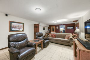 Basement living room with dining area and walk out access