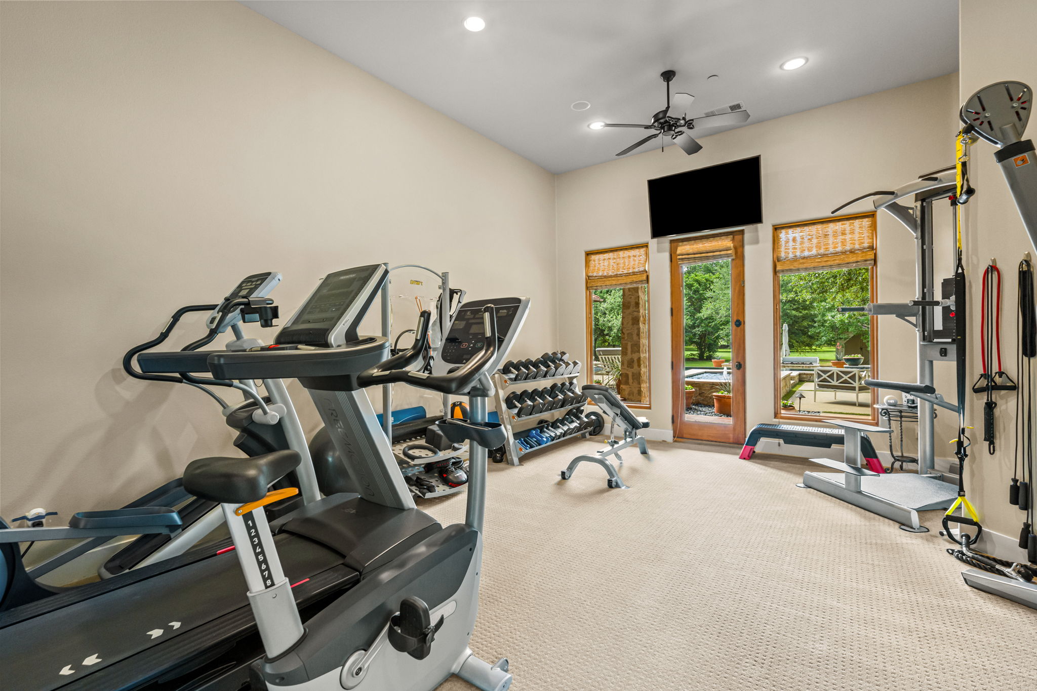 Gym overlooking spa and pool