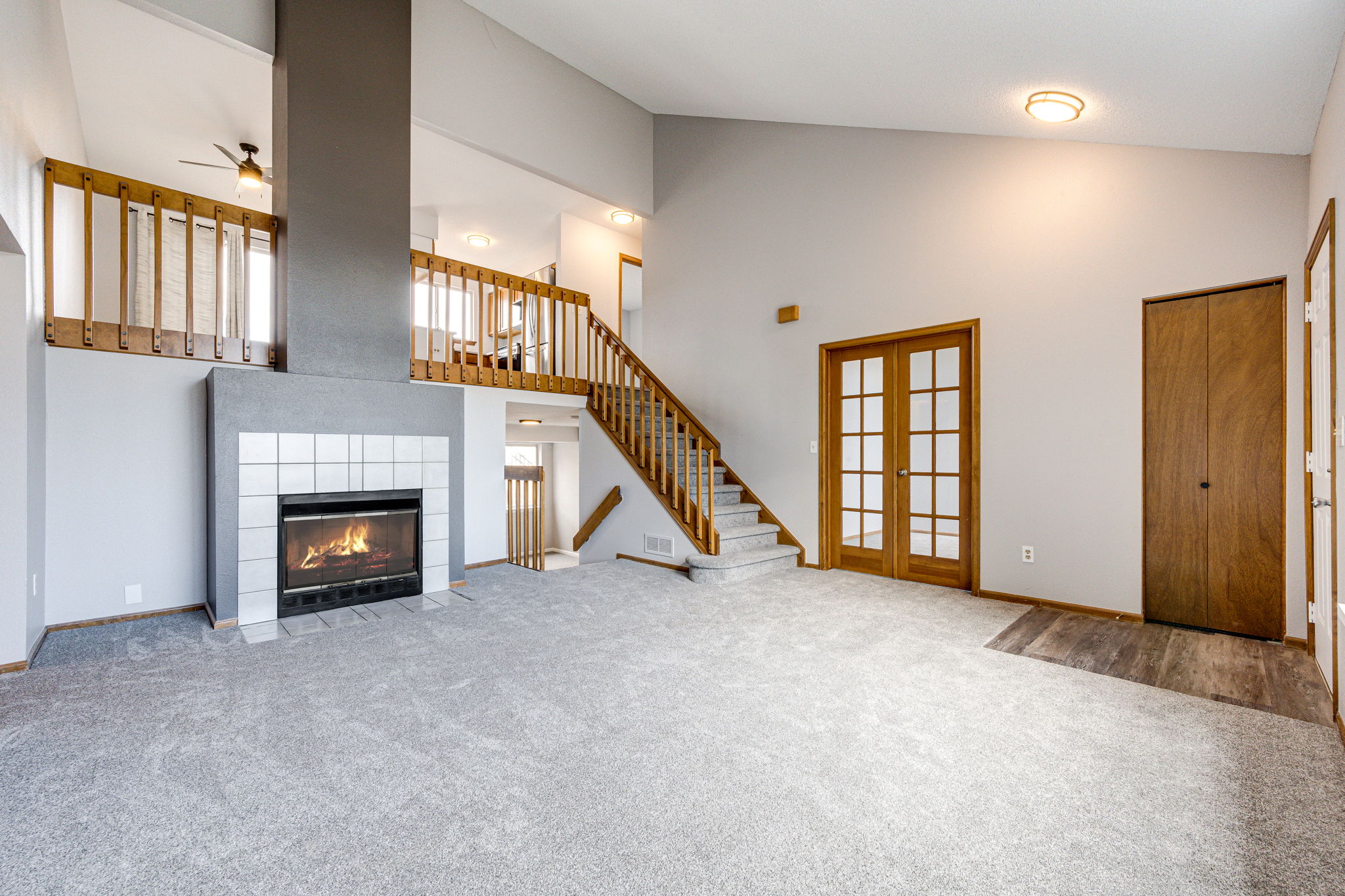 Living room area with a wood burning fireplace to keep you cozy on a chilly Colorado night