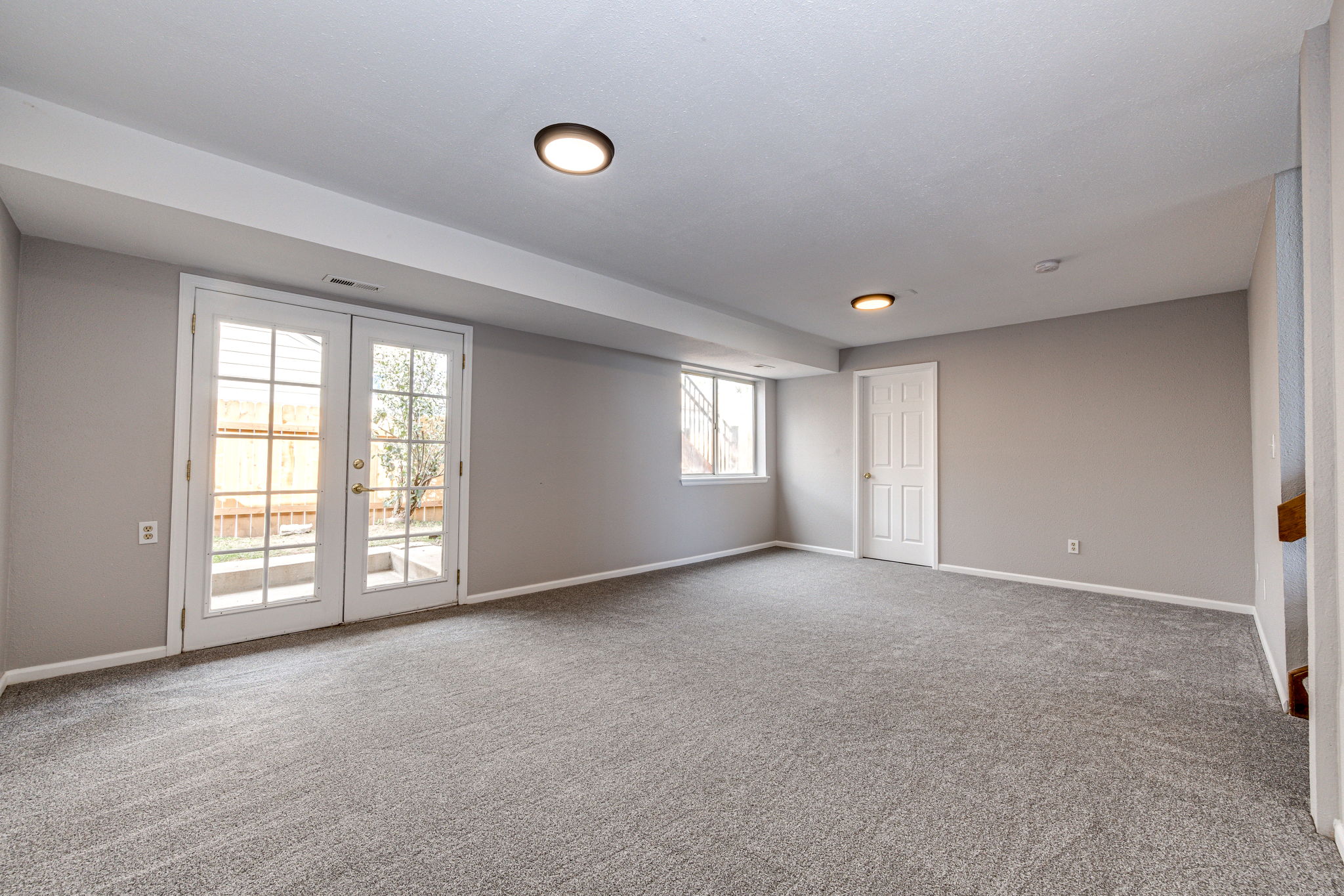 Family room with a view of the door where the laundry area is located
