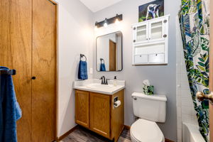 Upper level full bathroom with a linen closet