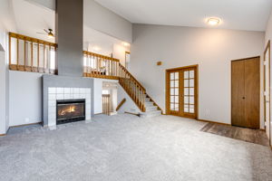 Living room area with a wood burning fireplace to keep you cozy on a chilly Colorado night