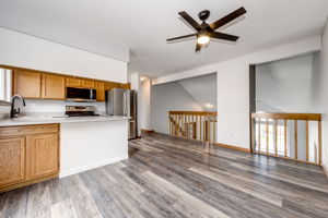 Corner view from the eat-in space. New ceiling fan and lighting fixtures throughout the home.