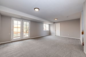 Family room with a view of the door where the laundry area is located