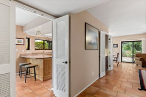 Entry into the home, looking towards the kitchen and living room