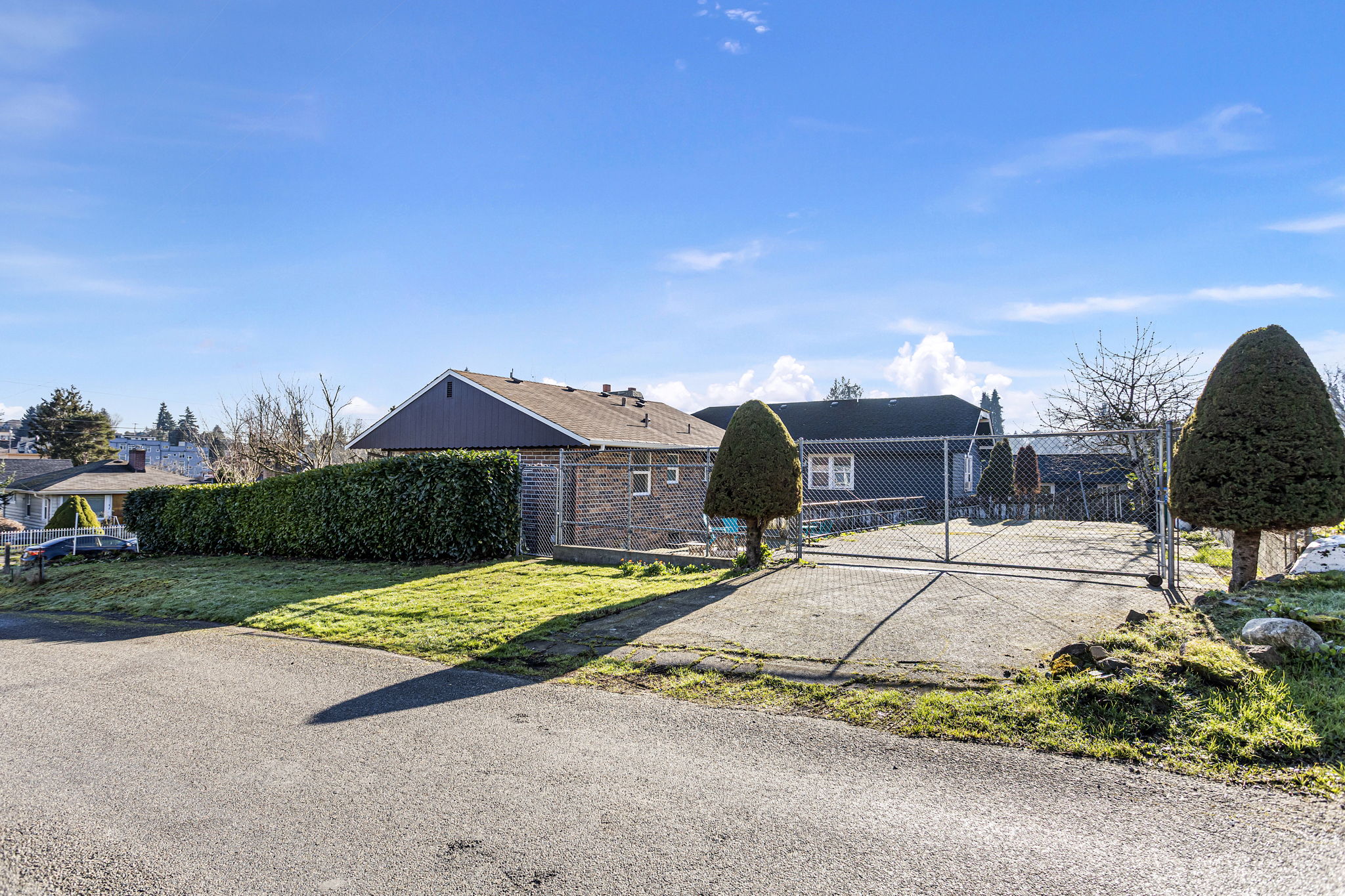 The rear approach highlights the home’s flexible access and separation from the street, reinforcing the benefits of the corner-lot setting.