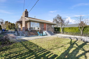 Set on a corner lot and slightly elevated above the street, this 1948 brick home offers privacy, natural light, and a reassuring sense of presence.