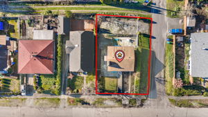 Aerial view of the corner lot with approximate boundaries shown; fully pre-inspected, priced accordingly, and offered in its present condition.