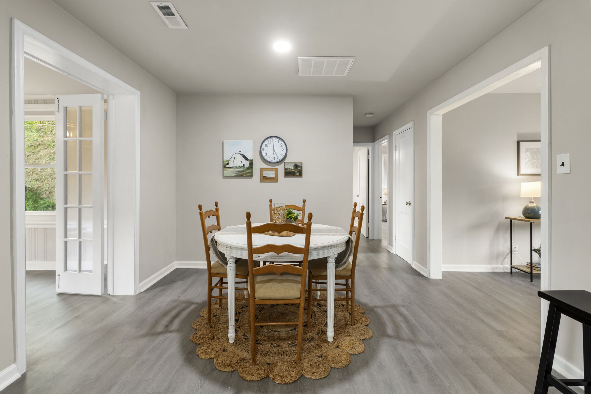 Dining room with recessed can lighting & new LVP flooring.
