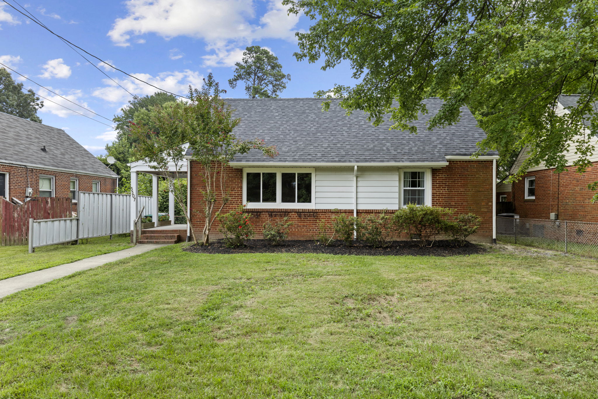 A low maintenance brick & aluminum exterior with new roof in 2024.