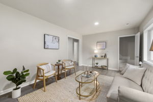 Bright updated living room with LVP floors & fresh paint.