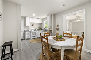 Dining area opens to the updated kitchen.