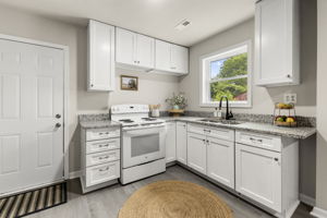 Updated kitchen with separate access to side covered porch.
