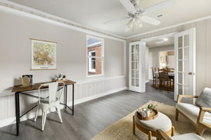 Glass French doors allow the rear family room to be closed off.