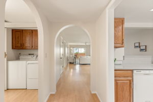 Foyer to living room/kitchen entry and hallway to bedrom 2, bath and laundry