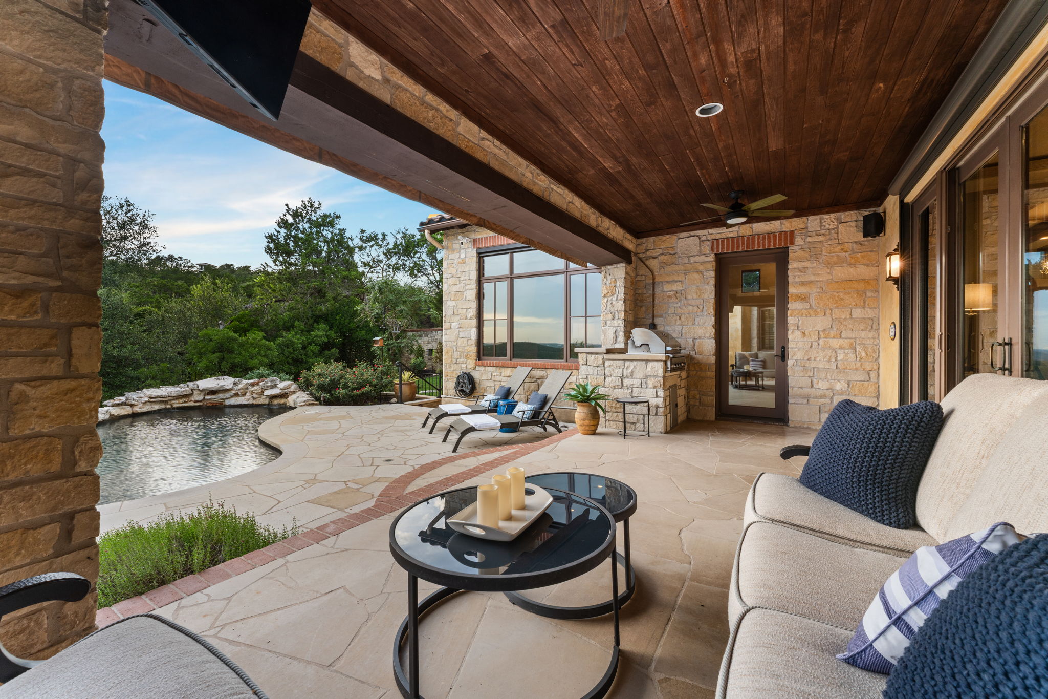 Access the covered patio from the primary bedroom, as well as from both of the downstairs living spaces.
