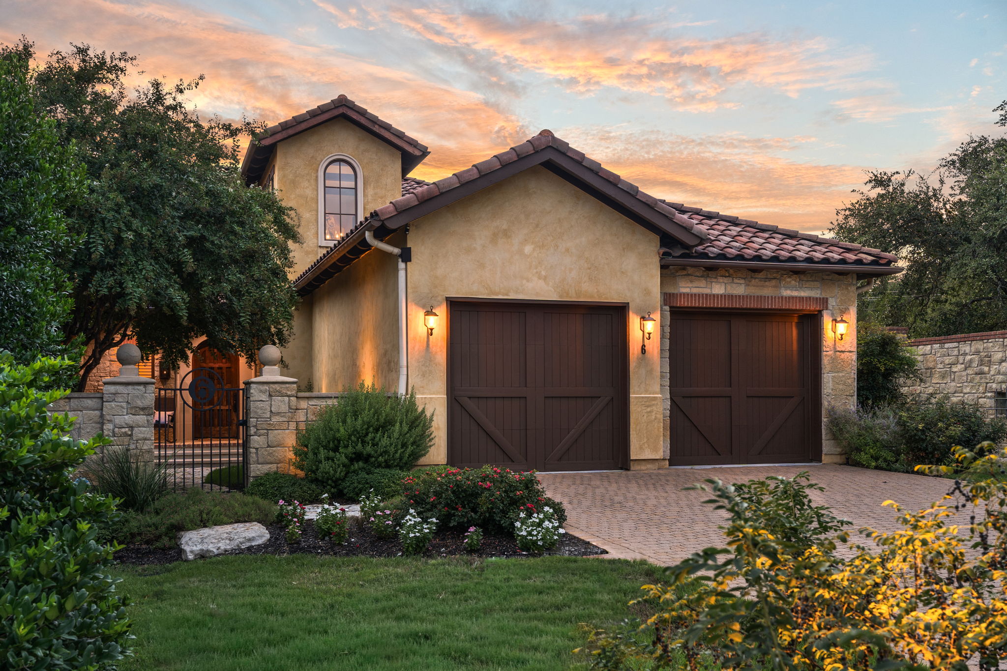 Lush, inviting yard is beautifully landscaped.