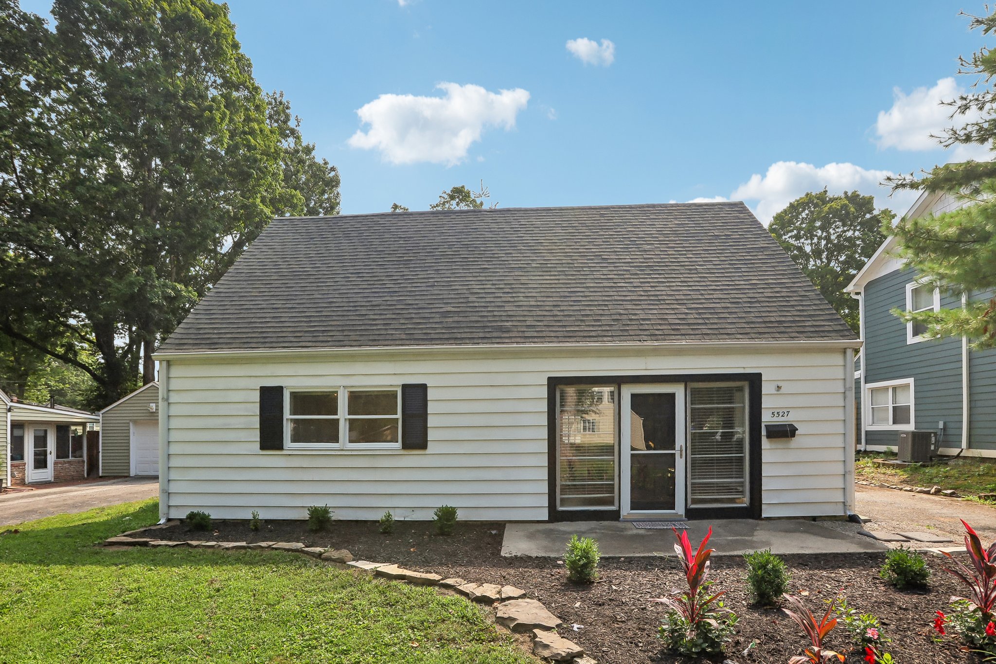 Picture-perfect Cape Cod curb appeal welcomes you home beneath a canopy of mature trees.