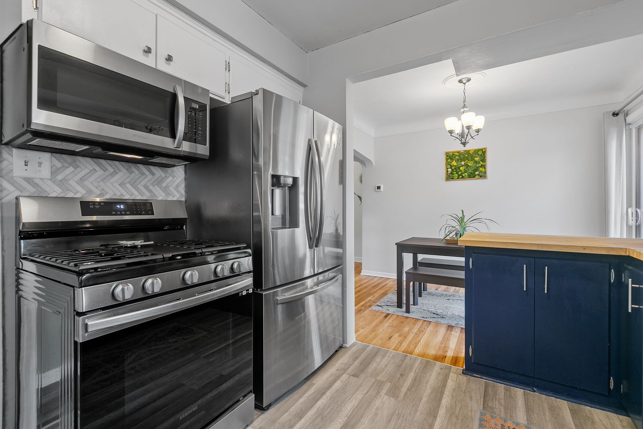 The kitchen at 5549 27th Avenue S is open to the informal dining space, providing a sense of spaciousness with views out to the privacy-fenced backyard.