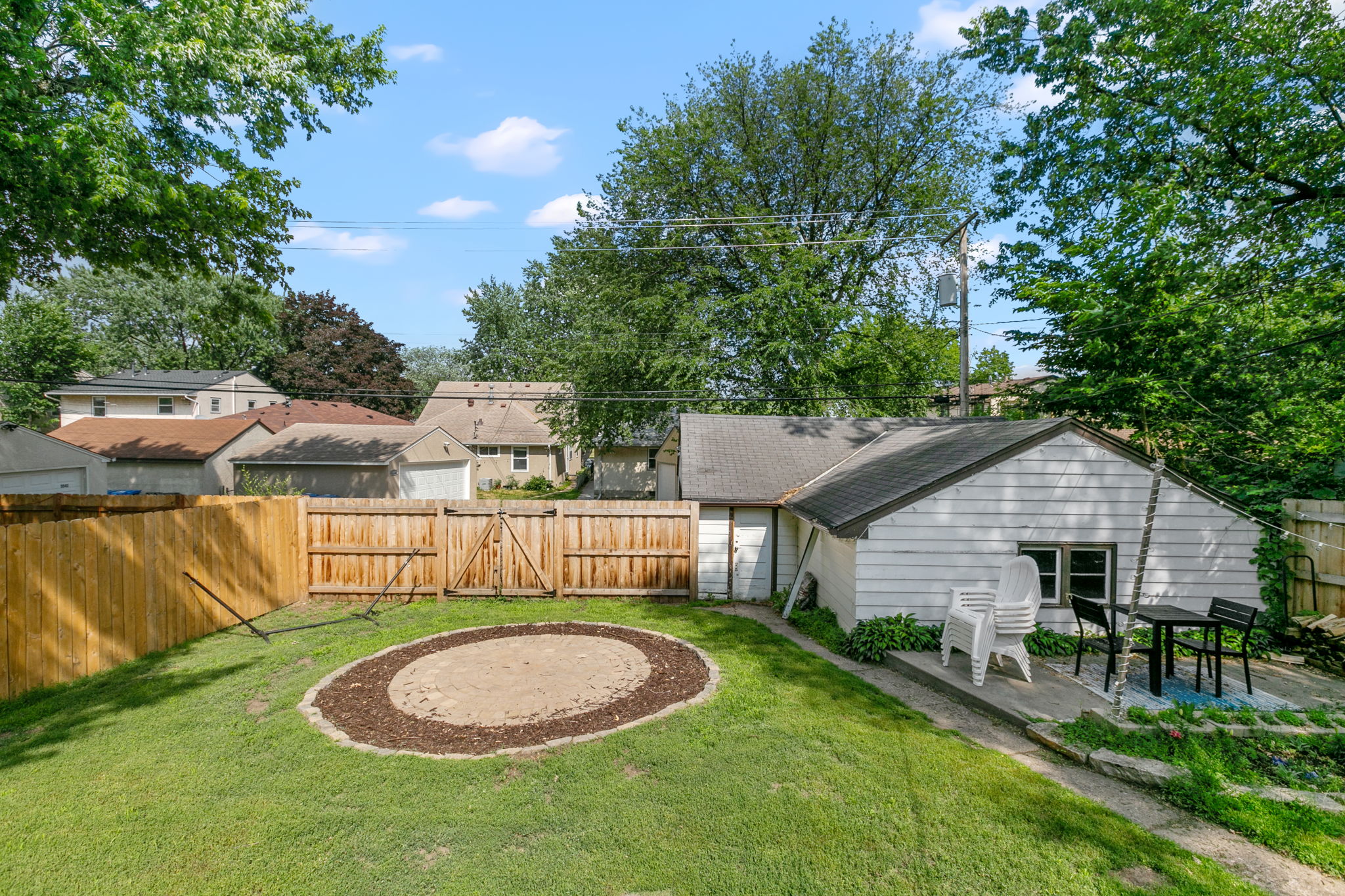 If you've been distracted by this beautiful backyard at 5549 27th Avenue S, you'll be forgiven if you haven't yet noticed the huge, oversized 2-car detached garage with a third-stall workshop space.