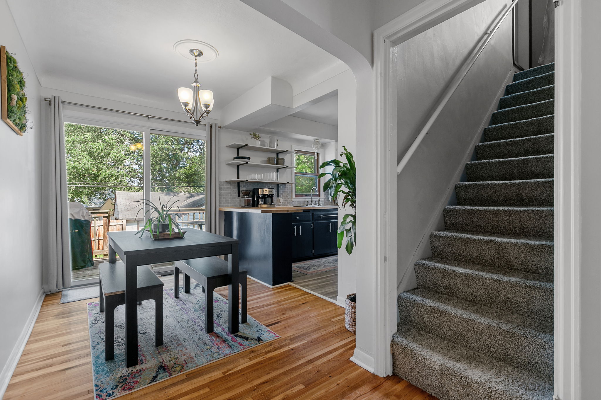 The kitchen at 5549 27th Avenue S is open to the informal dining space, providing a sense of spaciousness with views out to the privacy-fenced backyard.