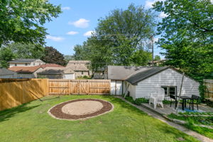 If you've been distracted by this beautiful backyard at 5549 27th Avenue S, you'll be forgiven if you haven't yet noticed the huge, oversized 2-car detached garage with a third-stall workshop space.