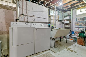 Alongside the adjacent finishing potential in the basement at 5549 27th Avenue S, the unfinished laundry + mechanical room is expansive and perfect for additional storage.