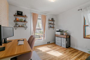 Pictured here, one of two main-level bedrooms at 5549 27th Avenue S is currently used as a home office.