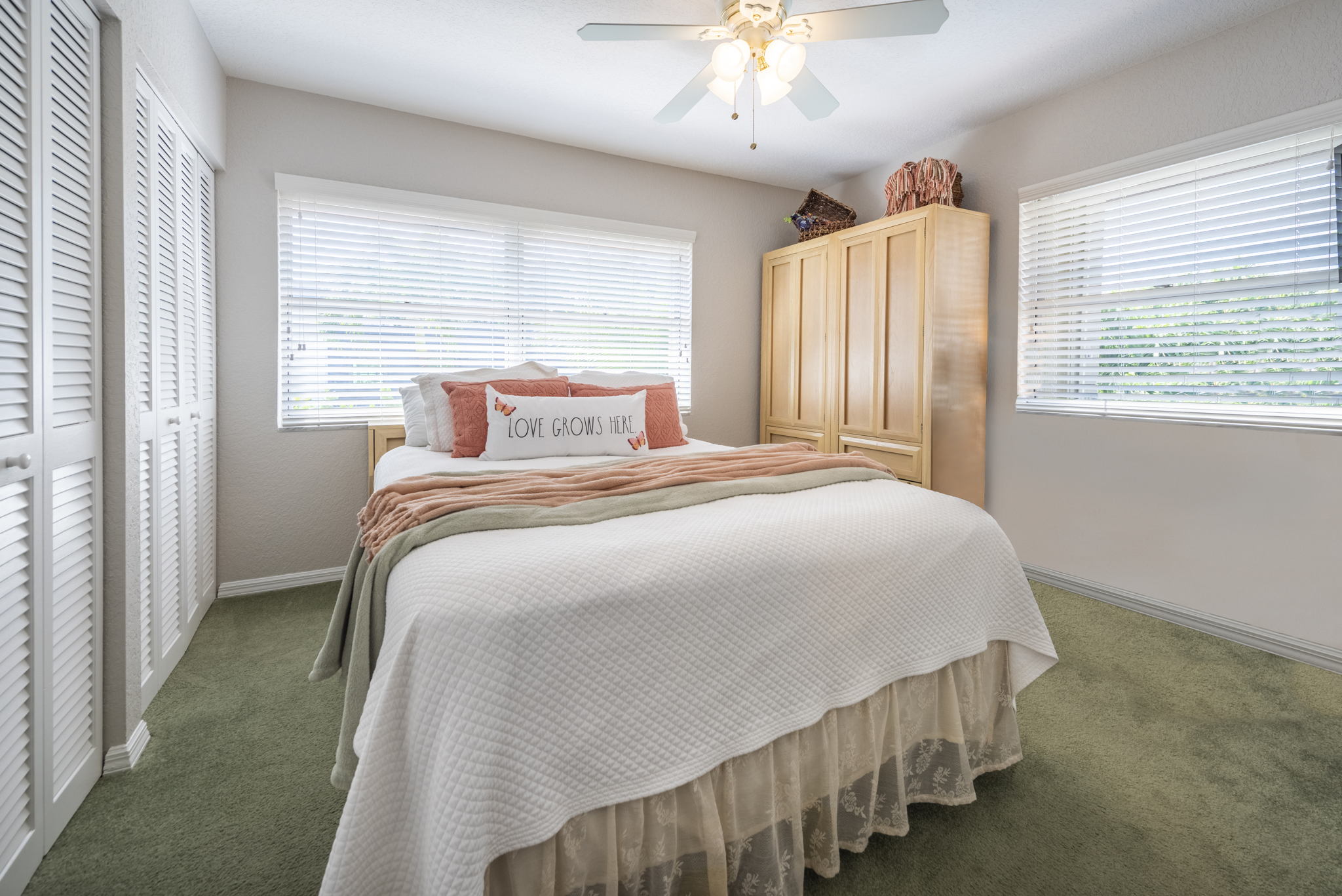 Guest bed accommodates a queen size bed and overlooks pool